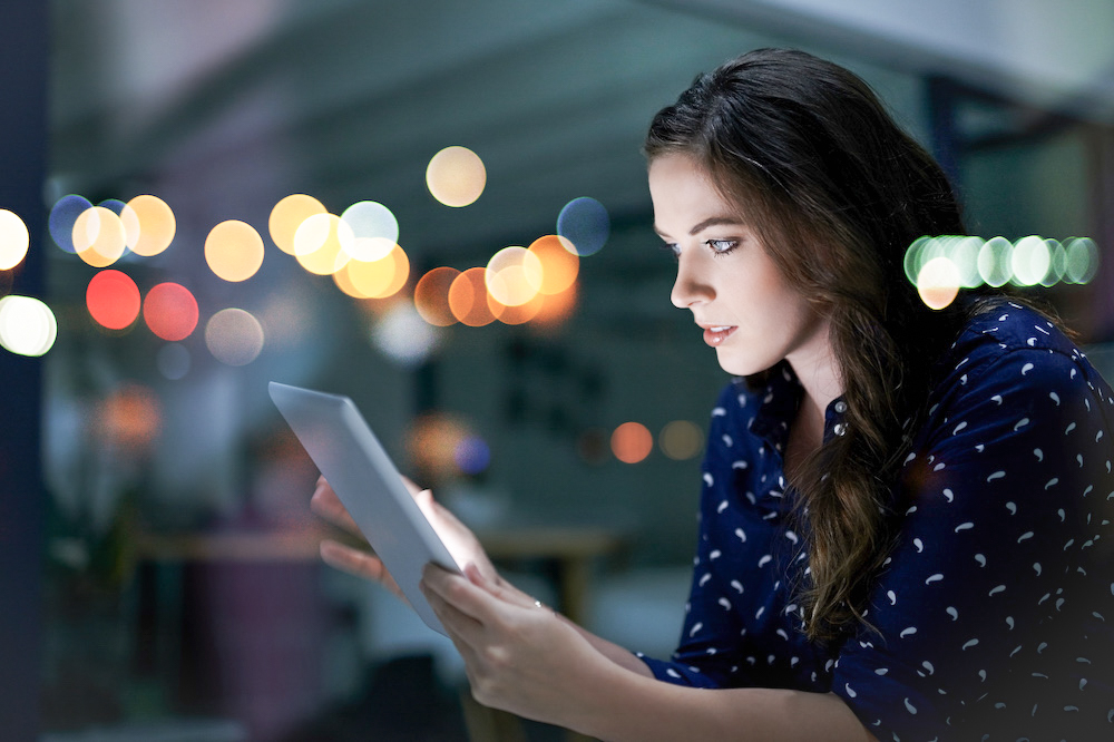 View of a woman using a tablet device