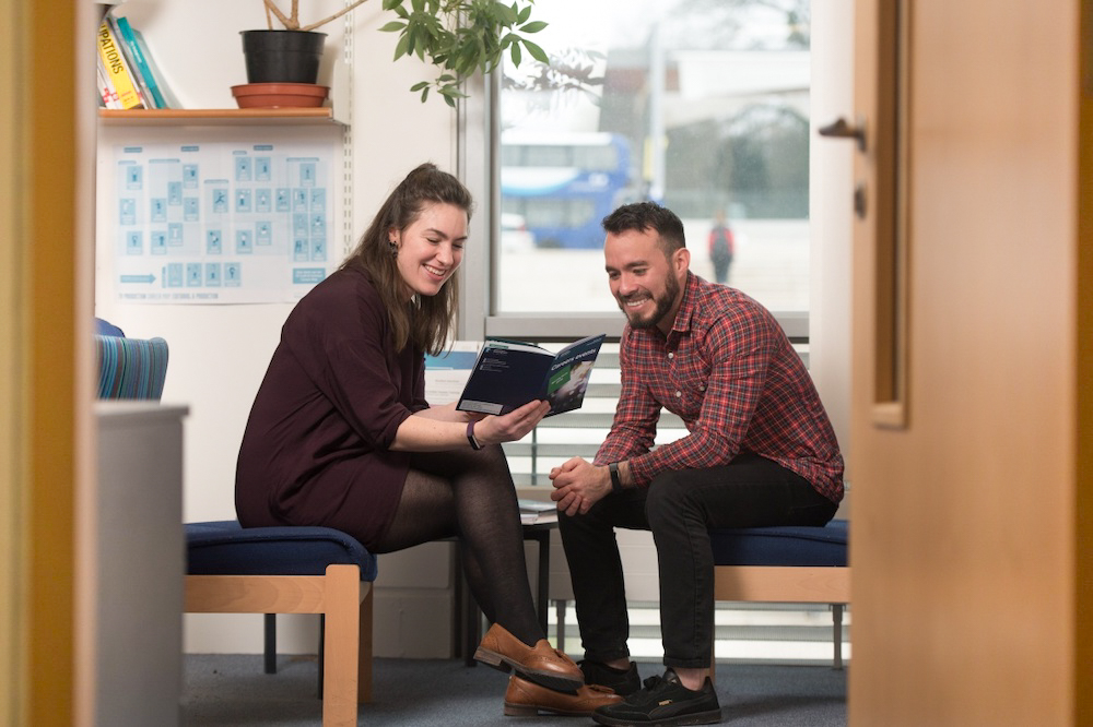 Careers adviser sitting with a student