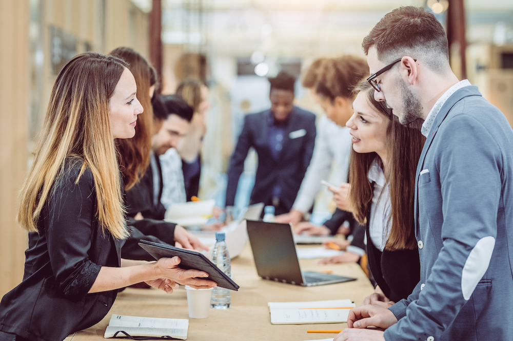 Students talking to a recruiter at an event